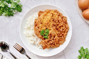 Thai style Rice with omelet stuff minced pork ,street food of thailand ,Thai call khao kai jeaw moo sab , Top view table