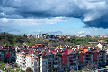 Before supercell storm in a city quarter