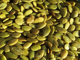 close up of green pumpkin seeds background