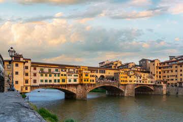 Obraz premium Ponte Vecchio bridge over the Arno river in Florence, Italy. Traditional Italian architecture in the Tuscany.