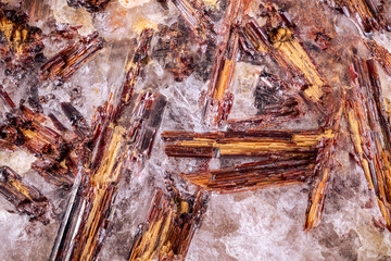 rutile crystals on quartz. macro detail texture background. close-up raw rough unpolished...