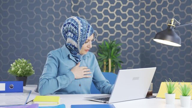 Hijab business woman fainting as a result of a heart attack.