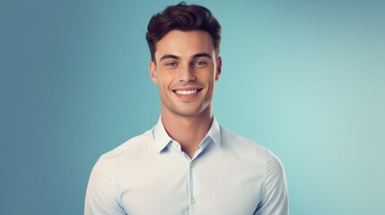 Young smilling business man posing on soft color background. 