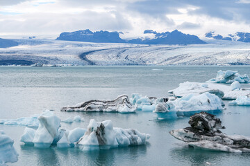  joekulsar lagoon with icebergs  and eroding glacier in Iceland