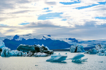  joekulsar lagoon with icebergs  and eroding glacier in Iceland