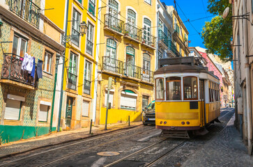 Fototapeta na wymiar Famous vintage tram in the street of Alfama, Lisbon, Portugal