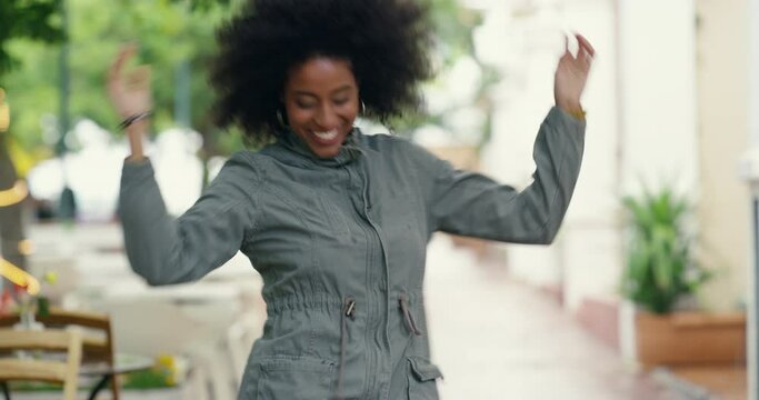 Dance, happy and woman in city, freedom and having fun outdoor in town. Dancing, smile and free African female person moving, excited and celebrating happiness, energy and performance in urban street