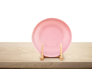 Ceramic plates in a wooden stand on a wooden table isolated PNG transparent
