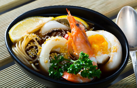 Spicy pan-Asian soup boiled with squid, shrimp, egg noodles and sesame