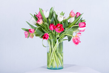 Beautiful bouquet arranged in a vase, on a white background