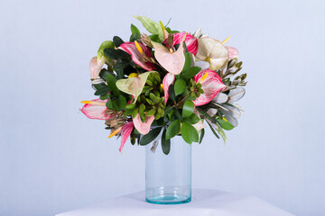 Beautiful bouquet arranged in a vase, on a white background