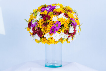 Beautiful bouquet arranged in a vase, on a white background