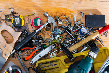 Assorted hand tools for renovations or DIY works on wooden table