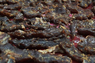 beef jerky that is being dried in the sun