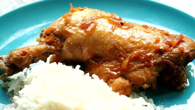 Stewed chicken in vinegar and soy sauce or Chicken Adobo. Filipino famous food.