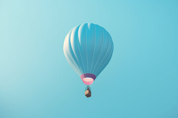Naklejka premium A blue hot air balloon isolated on a blue sky background