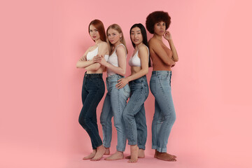 Portrait of beautiful young women on pink background