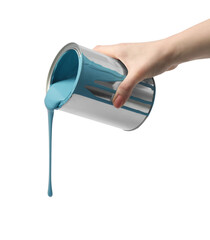 Woman pouring light blue paint from can on white background, closeup