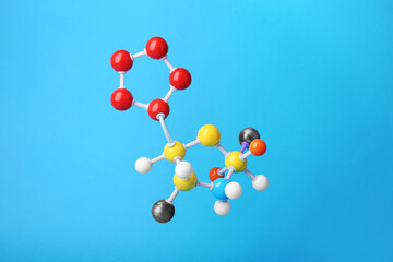 Structure of molecule on light blue background. Chemical model