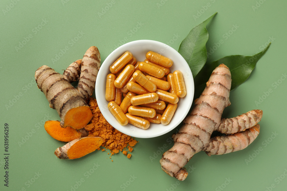 Poster Aromatic turmeric powder, pills and raw roots on green background, flat lay