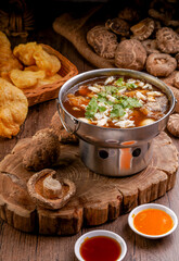 Braised Fish Maw in Red Gravy Soup with Crab in bowl