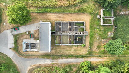 Wastewater waste water treatment plant old and rusty railing iron processes sedimentation,...