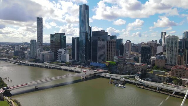 Aerial drone view of Brisbane City, QLD, Australia looking toward the west facing side of the city along Brisbane River and Riverside Expressway showing Neville Bonner Bridge in August 2023    