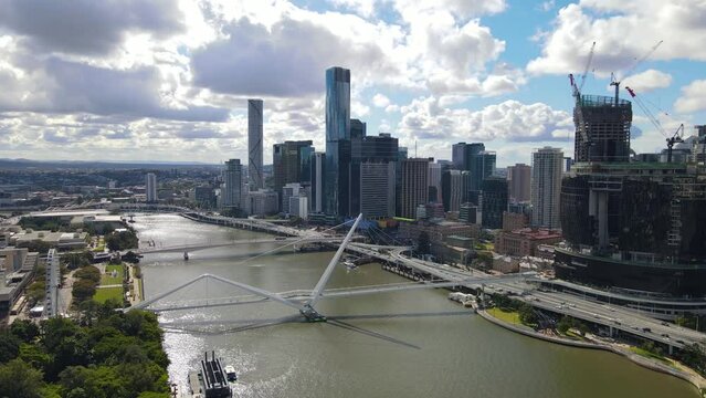 Aerial drone view of Brisbane City, QLD, Australia looking toward the west facing side of the city along Brisbane River and Riverside Expressway showing Neville Bonner Bridge in August 2023    