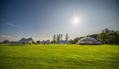 Camping tent on the grass in a sunny day © evening_tao
