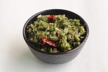 Stir fried chayote shoots, chayote or sechium edule leaf curry or salad