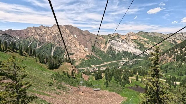 Mountain summer ski lift forest Snowbird Utah down. Summer winter season mountain resort. Vacation nature family fun destination. Peaks nature landscape forest. Rocky Mountain Salt Lake City Utah.