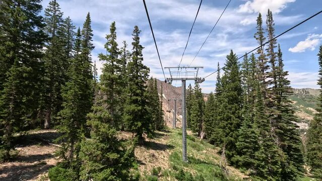 Mountain ski lift summer forest Snowbird Utah down. Summer winter season mountain resort. Vacation nature family fun destination. Peaks nature landscape forest. Rocky Mountain Salt Lake City Utah.