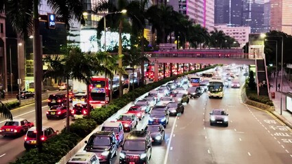 Hong Kong's Gloucester Road in Evening Rush Hour with City Lights and Skyscrapers