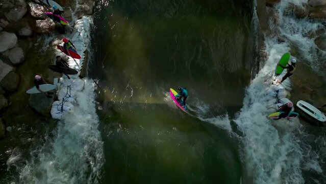 Salida Colorado aerial cinematic drone river surfing scout wave summer downtown S Lime Mill near Buena Vista on Arkansas River Riverside Park community rafting Rocky Mountain looking down up movement