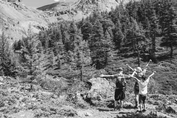 People in the mountains. Black and white toned image 