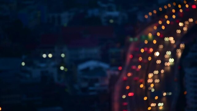Bokeh abstract blurred background festive traffic red lights car on road sparkling circular animate motion 3D. Backdrop with twinkling bright shape blinking lights in modern city