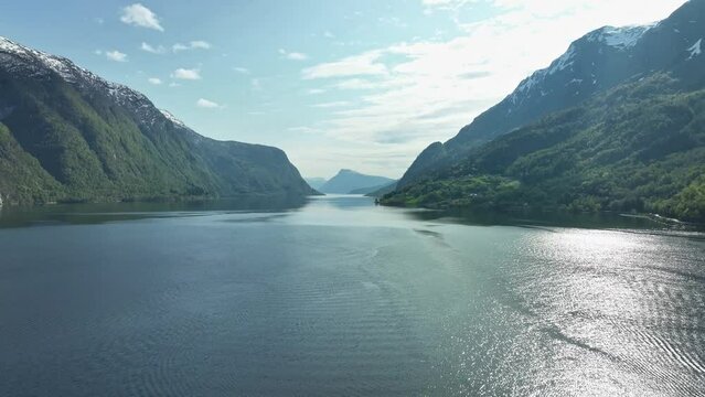 Lustrafjorden Norway - And arm of Sognefjord seen from Skjolden during sunny spring day - Forward moving rising aerial