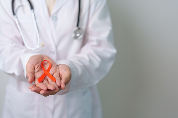 Orange Ribbon for Leukemia, Kidney cancer day, world Multiple Sclerosis, CRPS, Self Injury Awareness month. Healthcare and word cancer day concept