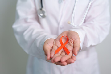 Orange Ribbon for Leukemia, Kidney cancer day, world Multiple Sclerosis, CRPS, Self Injury Awareness month. Healthcare and word cancer day concept