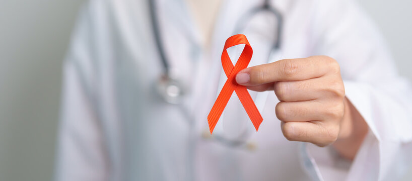 Orange Ribbon for Leukemia, Kidney cancer day, world Multiple Sclerosis, CRPS, Self Injury Awareness month. Healthcare and word cancer day concept