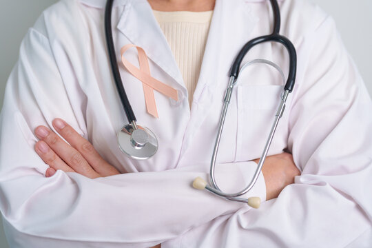 Peach Ribbon for September Uterine Cancer Awareness month. Healthcare and World cancer day concept