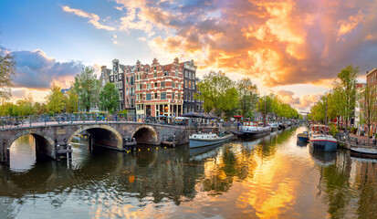 Amsterdam. Panoramic view of the downtown of Amsterdam. Traditional houses and bridges of Amsterdam.   Europe, Netherlands, Holland, Amsterdam.
