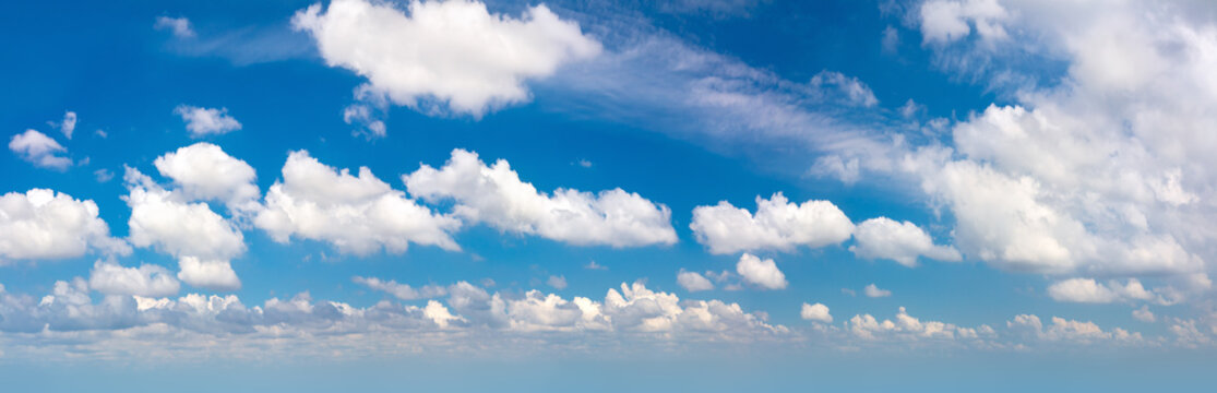 Panorama of real blue sky during daytime with white light clouds Freedom and peace. Large photo format Cloudscape