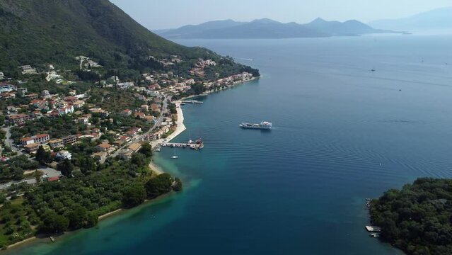 Aerial view of the Nydri bay in Lefkada, Greece with a transport ship returning to harbor
