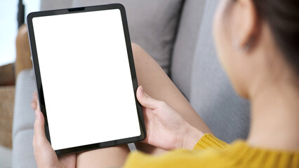 Woman hand using digital tablet with blank screen for mock up, template, people technology and lifestyle