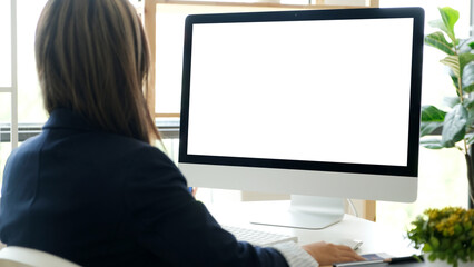 Woman using desktop computer with blank screen for mock up template background
- 631988660
