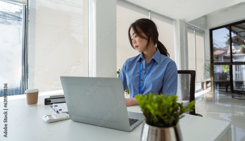 Poster female accountant working on a tablet computer in a modern office. make an account analysis report. 