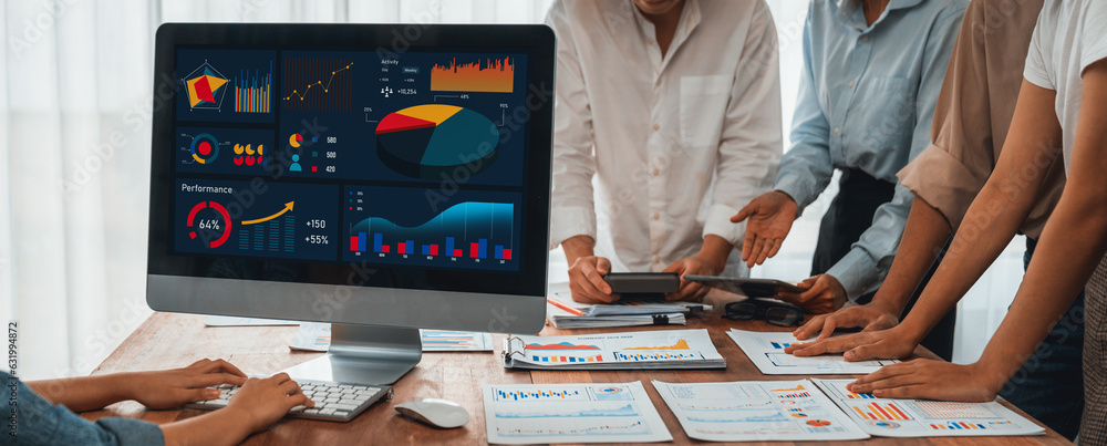 Fototapete Panorama shot analyst team utilizing BI Fintech to analyze financial report with laptop. Businesspeople analyzing BI power dashboard displayed on laptop screen for business insight. Scrutinize