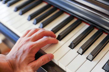 piano keyboard, a harmonious blend of black and white keys, symbolizing the balance between light...