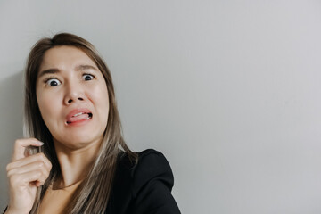 Fototapeta na wymiar Asian office women with surprise and shock face.